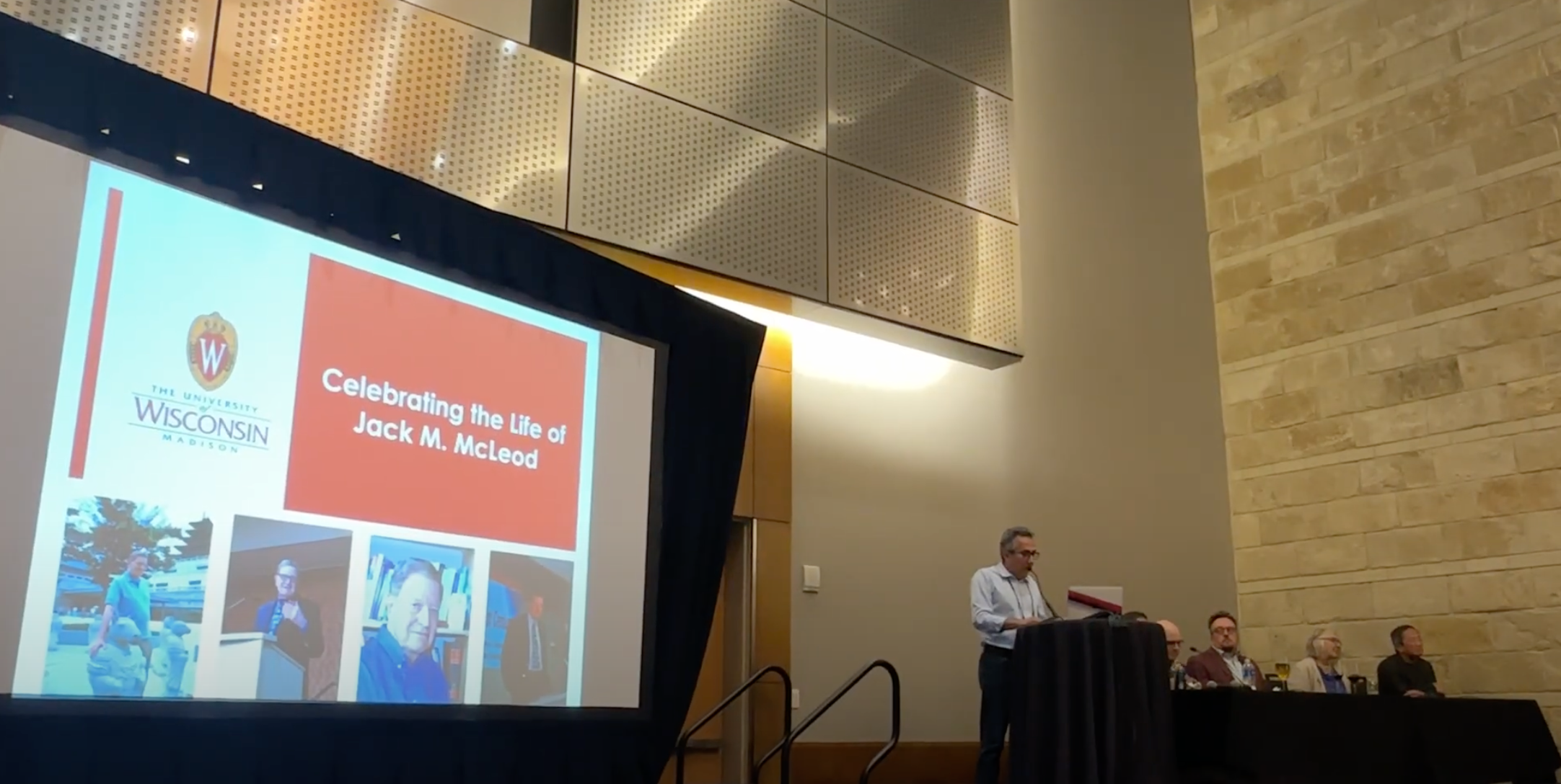 Hernando Rojas speaks at the Celebration of Jack McLeod at ICA.